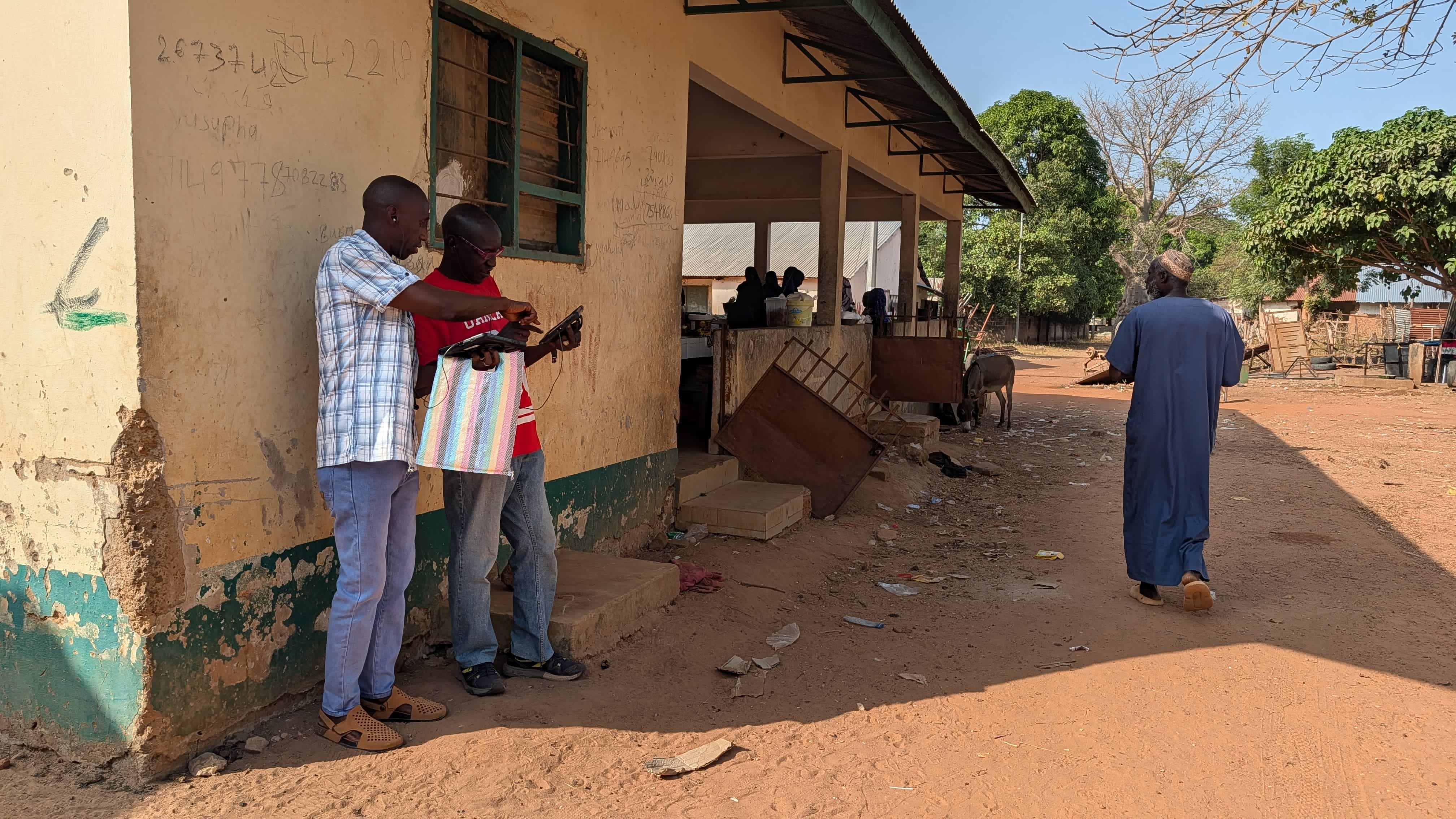 Two observers discuss behaviors as they record them on their tablet